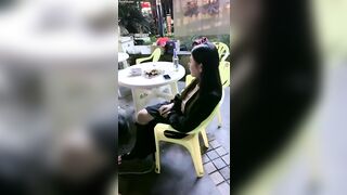 Chinese mistress feeding her dog in public