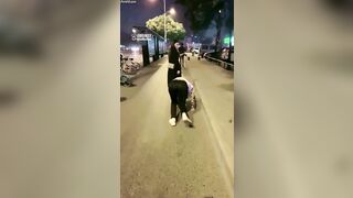 Chinese mistress feeding her dog in public