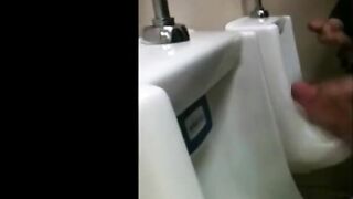 two slim dicks getting wanked at the urinals 2