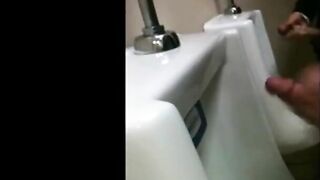 two slim dicks getting wanked at the urinals 2