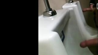 two slim dicks getting wanked at the urinals 2