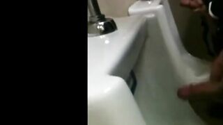 two slim dicks getting wanked at the urinals 2