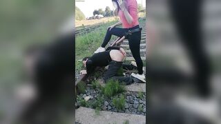 Mistress Israeli with slave in public scene