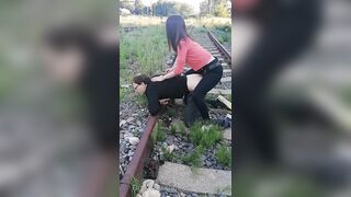 Mistress Israeli with slave in public scene