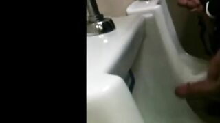 two slim dicks getting wanked at the urinals 3