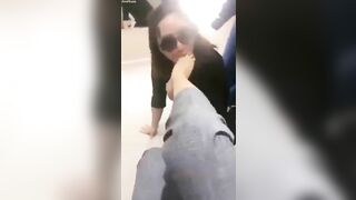 Mistress and her foot slave in public
