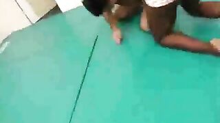 Black Girl wrestles helpless man